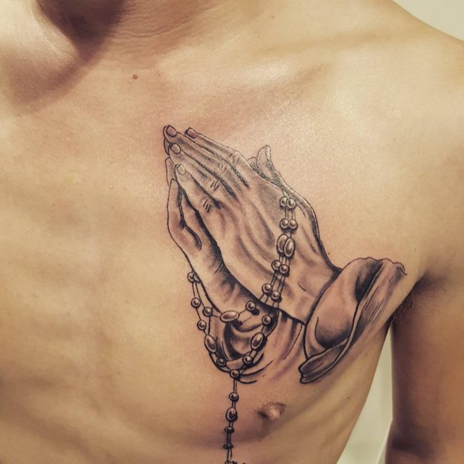 Amazing Praying Hand With Rosary Roses Tattoo On Chest