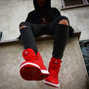 10 Black Ripped Jeans with Red Air Jordan Shoes