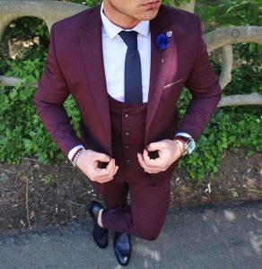 25 A presidential Pocket Square on a Three Piece Burgundy Suit