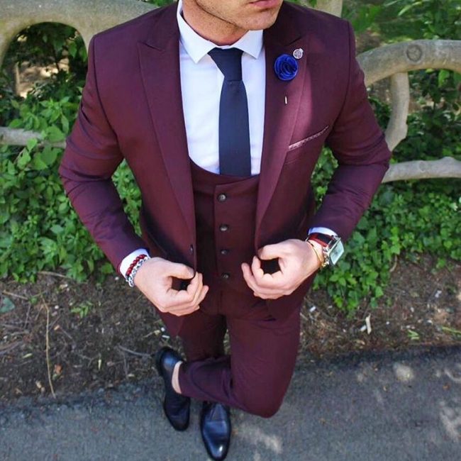 25 A presidential Pocket Square on a Three Piece Burgundy Suit